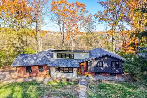 Modern Riverfront Elegance Surrounded by Natural Serenity