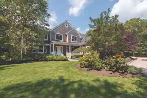 Refined Quogue Retreat with Tennis and Poolside Luxury