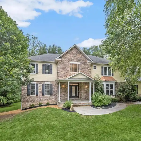 CUSTOM MASTERPIECE SURROUNDED BY MATURE TREES