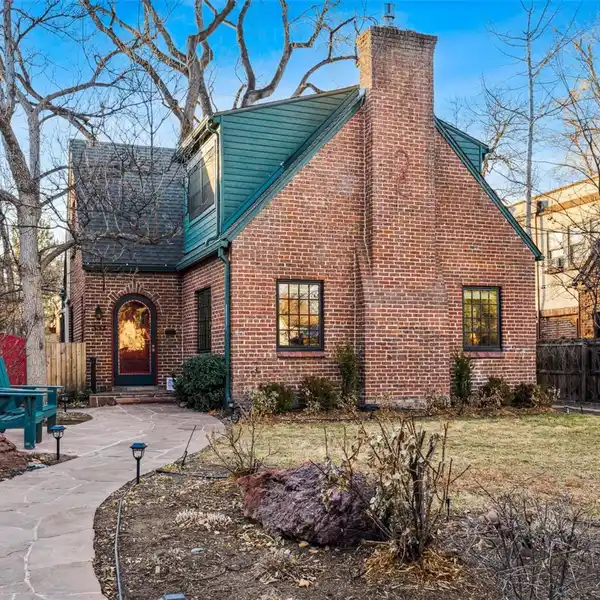 CHARMING TUDOR HOME SITUATED ON A PICTURESQUE HILLTOP STREET