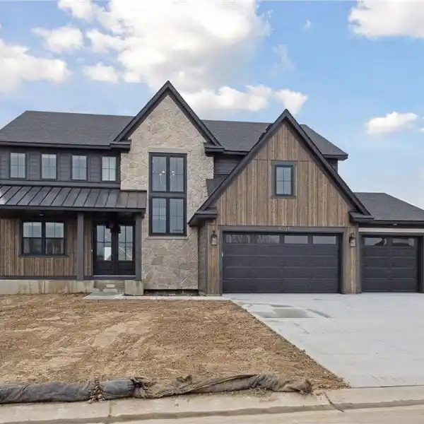 FABULOUS NEW CONSTRUCTION ON AN OVERSIZED WOODED LOT