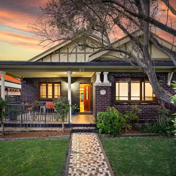 PRIVATE SANCTUARY BEHIND A VIBRANT GARDEN