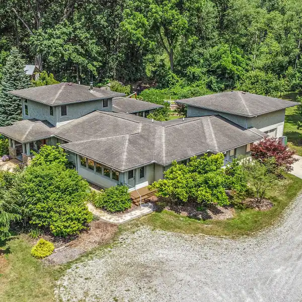DESIGNER HOME SURROUNDED BY RARE TREES