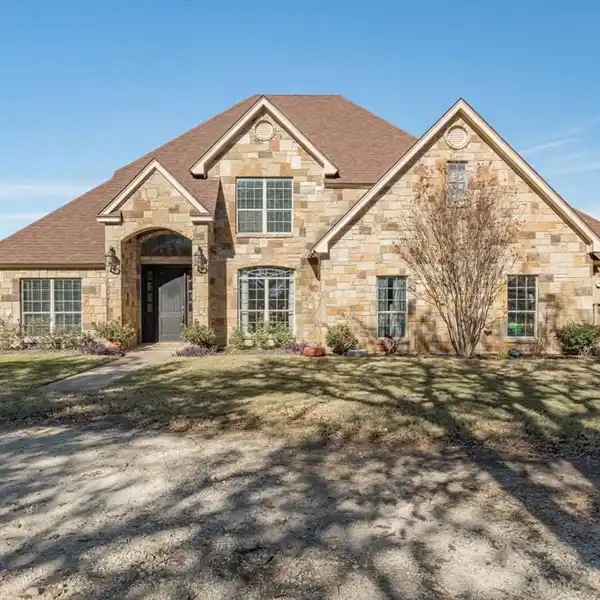 EXPANSIVE RANCH RETREAT WITH BARN, POND, AND PRIVACY