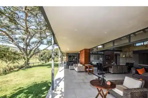 Dual-Home Masterpiece in Exclusive Estate Setting