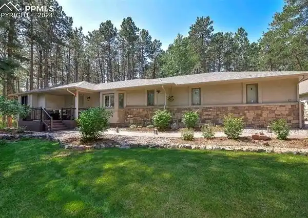 STUNNING STUCCO AND STONE RANCHER IN DESIRABLE WOODMOOR