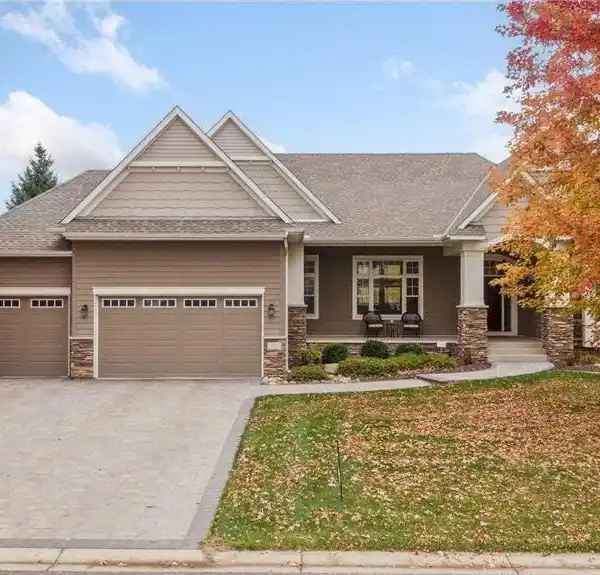 SPACIOUS EXECUTIVE RAMBLER WITH LOWER-LEVEL ENTERTAINMENT SPACES