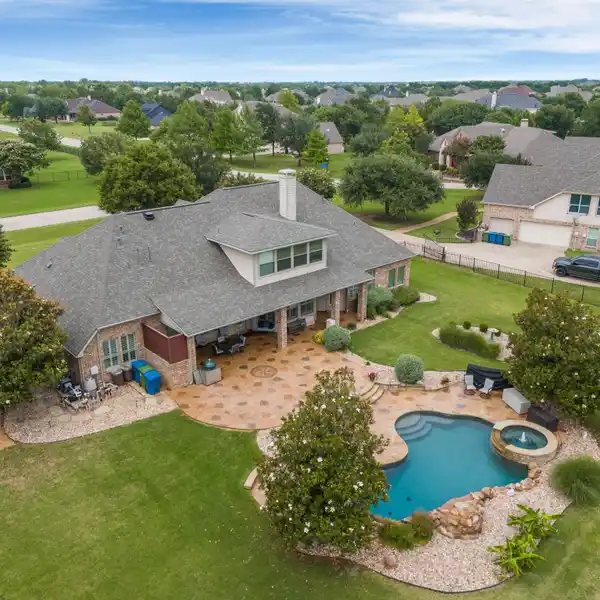 IMPECCABLE MAINTAINED HOME ON A LUSH ACRE
