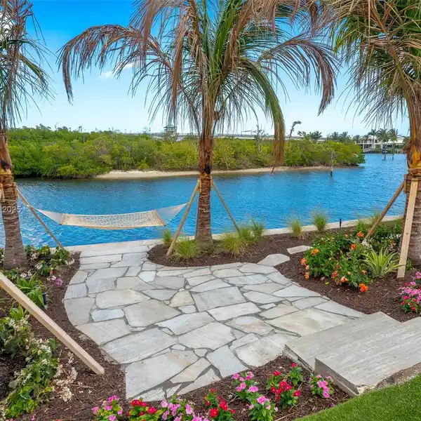 UPDATED HOME IN AN EXCLUSIVE WATERFRONT ENCLAVE