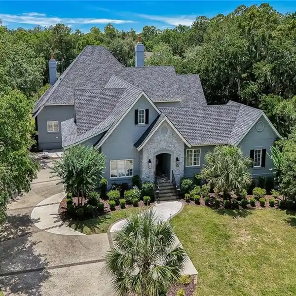 STEP INTO THE CHARM OF LOWCOUNTRY LIVING WITH THIS BEAUTIFULLY RENOVATED RETREAT ON A SERENE SALTWATER LAGOON IN THE PRESTIGIOUS COLLETON RIVER CLUB.