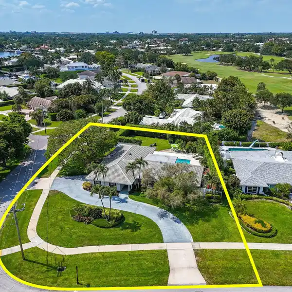 COUNTRY CLUB LIVING ON A PRIME CORNER LOT