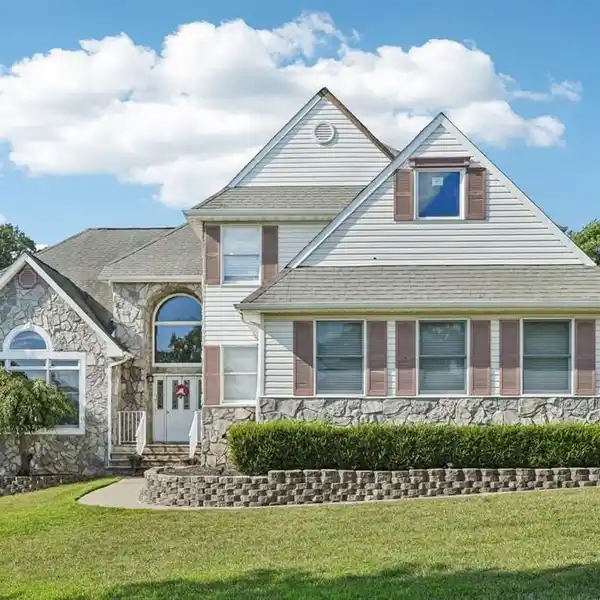 EXQUISITE COLONIAL HOME ON A MANICURED LOT