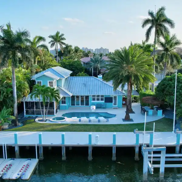 NEARLY NEW CUSTOM HOME IN A COVETED WATERFRONT COMMUNITY