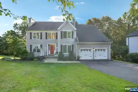 Exquisite Center Hall Colonial Set on Pristine Manicured Lot
