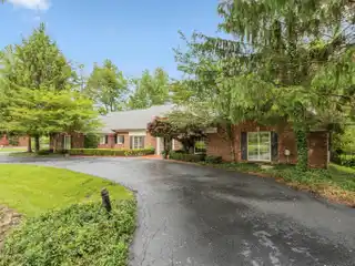 Elegant Brick Estate with Pool and Privacy