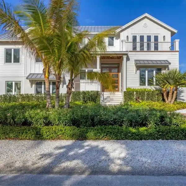 NEW CUSTOM WATERFRONT RESIDENCE OFFERING THE ULTIMATE ISLAND LIFESTYLE