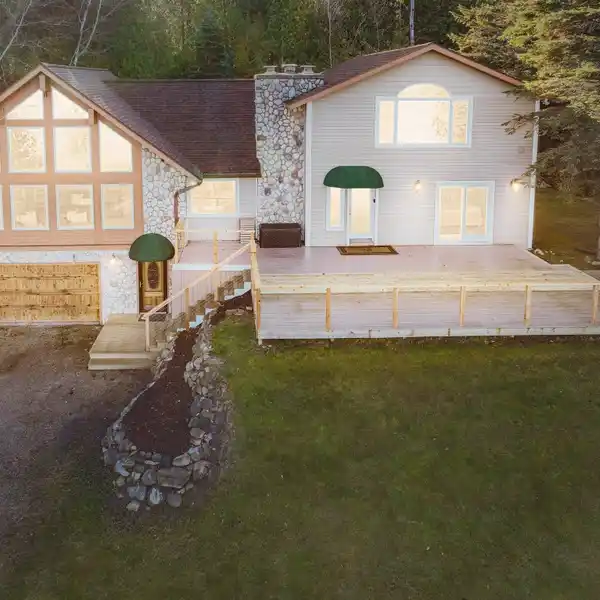 UPDATED HOME IN A BEAUTIFUL SETTING ON LAKE CHARLEVOIX