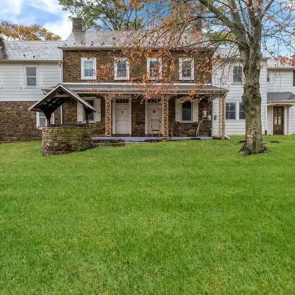 BRICK FIREPLACE ANCHORS FORMAL LIVING ROOM