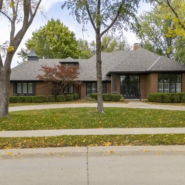 ELEGANT CORNER-LOT HOME WITH GRAND ARCHITECTURAL DETAILS