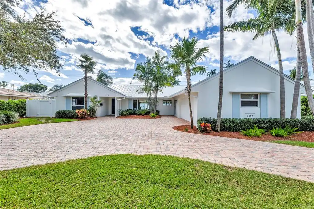 Pristine Pool Home in Highly Sought-after Coral Ridge Country Club