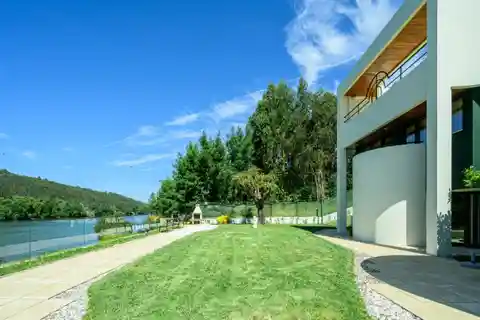 Architectural Villa with Private Mooring and Riverfront Views