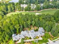 GRAND CUSTOM HOME IN SOUGHT-AFTER RIVER CLUB