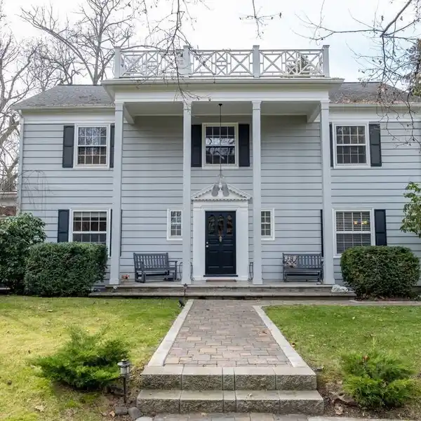 STUNNING COLONIAL HOME IN A GARDEN SETTING