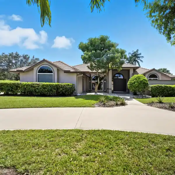 ELEGANT GATED ESTATE WITH VAULTED LIGHT-FILLED INTERIORS