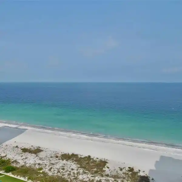 TURNKEY BEACHFRONT CONDO WITH DESIGNER FINISHES