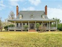 WONDERFULLY SPACIOUS HOME ON THREE ACRES IN THE HEART OF THIBODAUX