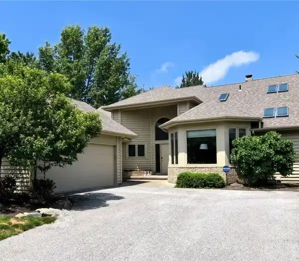 ONE-OF-A-KIND VILLAGE HOME WITH WALKOUT LEVEL