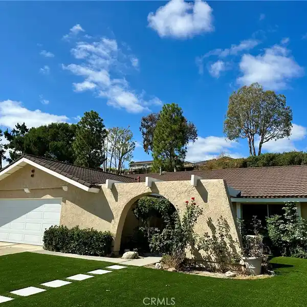SPACIOUS BACKYARD OASIS WITH HILLSIDE LANDSCAPING OPPORTUNITIES