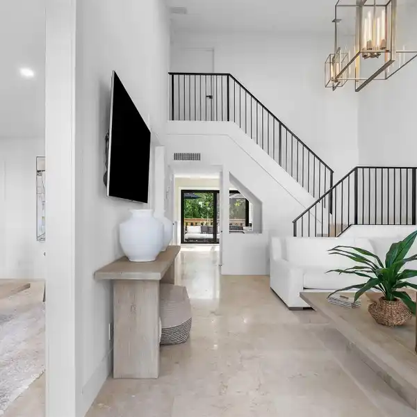 MODERN COASTAL ESCAPE STEPS FROM THE SAND