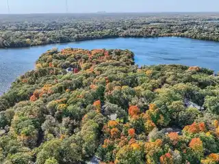 Custom Home on a Private Wooded Lot on the Island of Pleasant Lake
