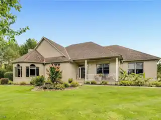 Beautifully Maintained Ranch Complete with a Private Pond