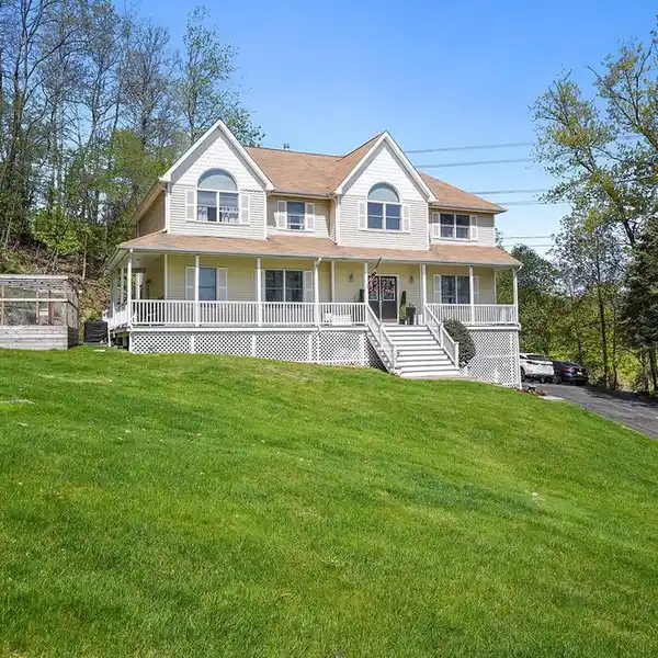 CENTER HALL COLONIAL ON PARK-LIKE PROPERTY