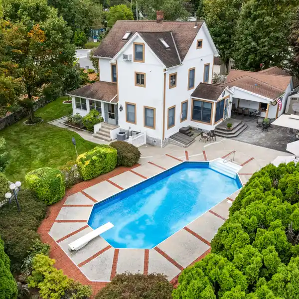 GRACIOUS COLONIAL ON A BEAUTIFULLY LANDSCAPED .34-ACRE PROPERTY