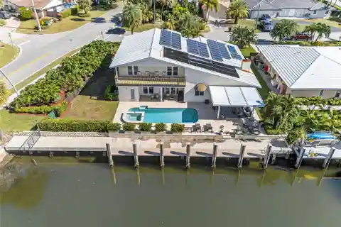Expansive Waterfront Oasis with Solar-Powered Luxury