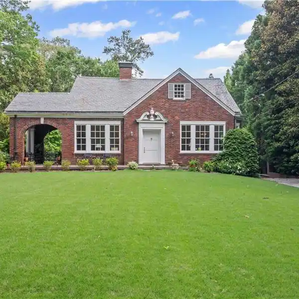 CLASSIC ALL-BRICK TUDOR OFFERING MODERN LIVABILITY
