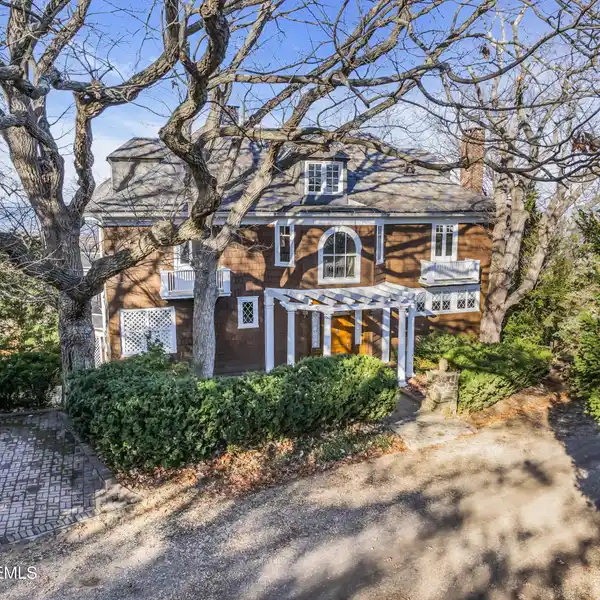 STUNNING COLONIAL REVIVAL WITH STATELY DESIGN FEATURES
