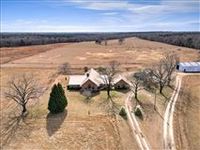 CUSTOM BRICK HOME ON 170-ACRE FARM