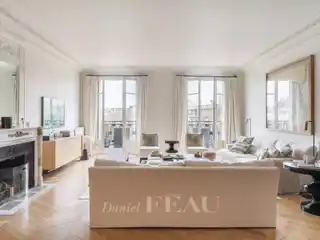 Haussmannian Elegance with Continuous Balcony Views