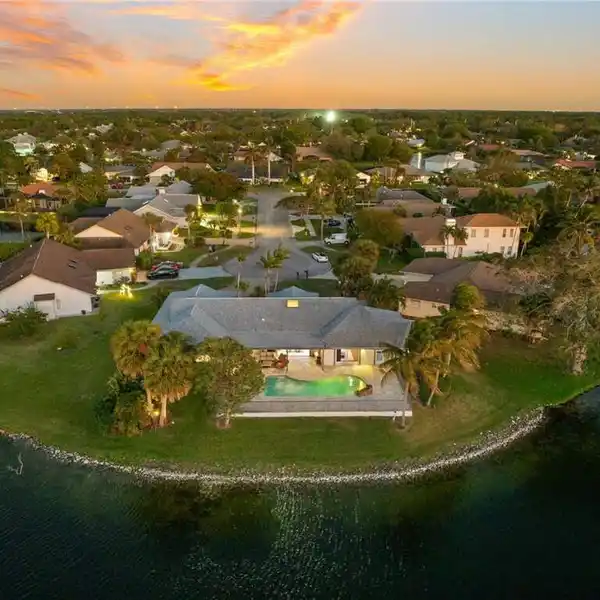 REMODELED PINEWOODS HOME WITH EXPANSIVE LAKE VIEWS