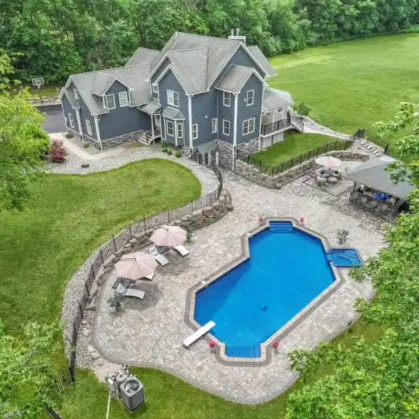 GRAND CUSTOM COLONIAL WITH RESORT STYLE AMENITIES