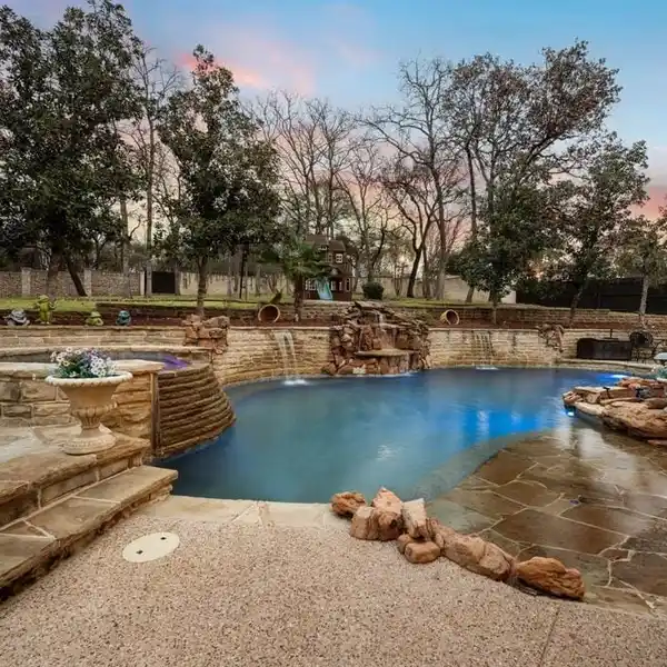 IMPRESSIVE HOME ON A HEAVILY TREED CORNER LOT