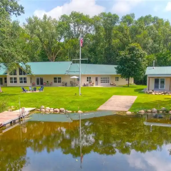 CUSTOM ONE-LEVEL HOME ON TWO LAKEFRONT ACRES