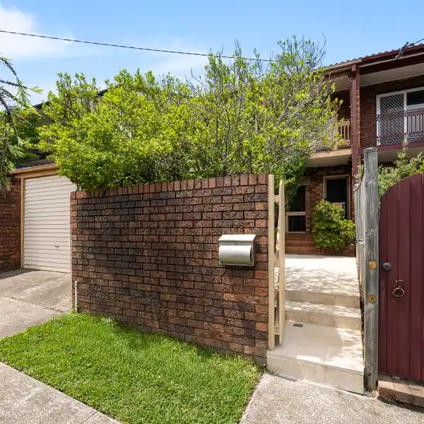 STYLISH DOUBLE-BRICK FAMILY HOME WITH SUN-FILLED COURTYARD