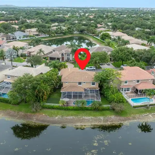 BEAUTIFULLY MAINTAINED TWO-STORY LAKEFRONT POOL HOME