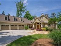 EXQUISITE LAKEFRONT ESTATE IN DESIRABLE SANDY FORD AREA