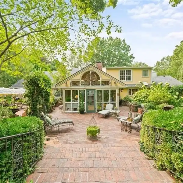 ELEGANT ESTATE WITH LUSH GARDENS AND TIMELESS DESIGN